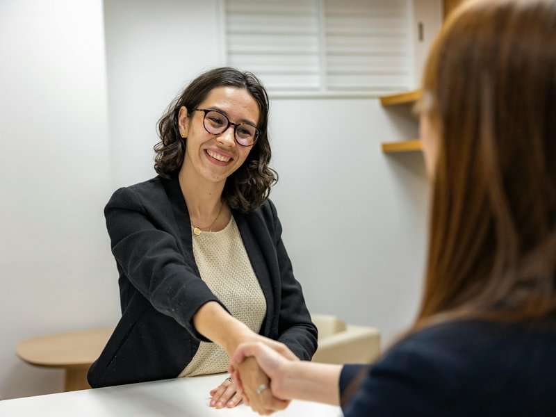 Showroom Associate working in a flooring retail showroom assisting customers with product selections and front desk duties in a St. Charles, Missouri store.